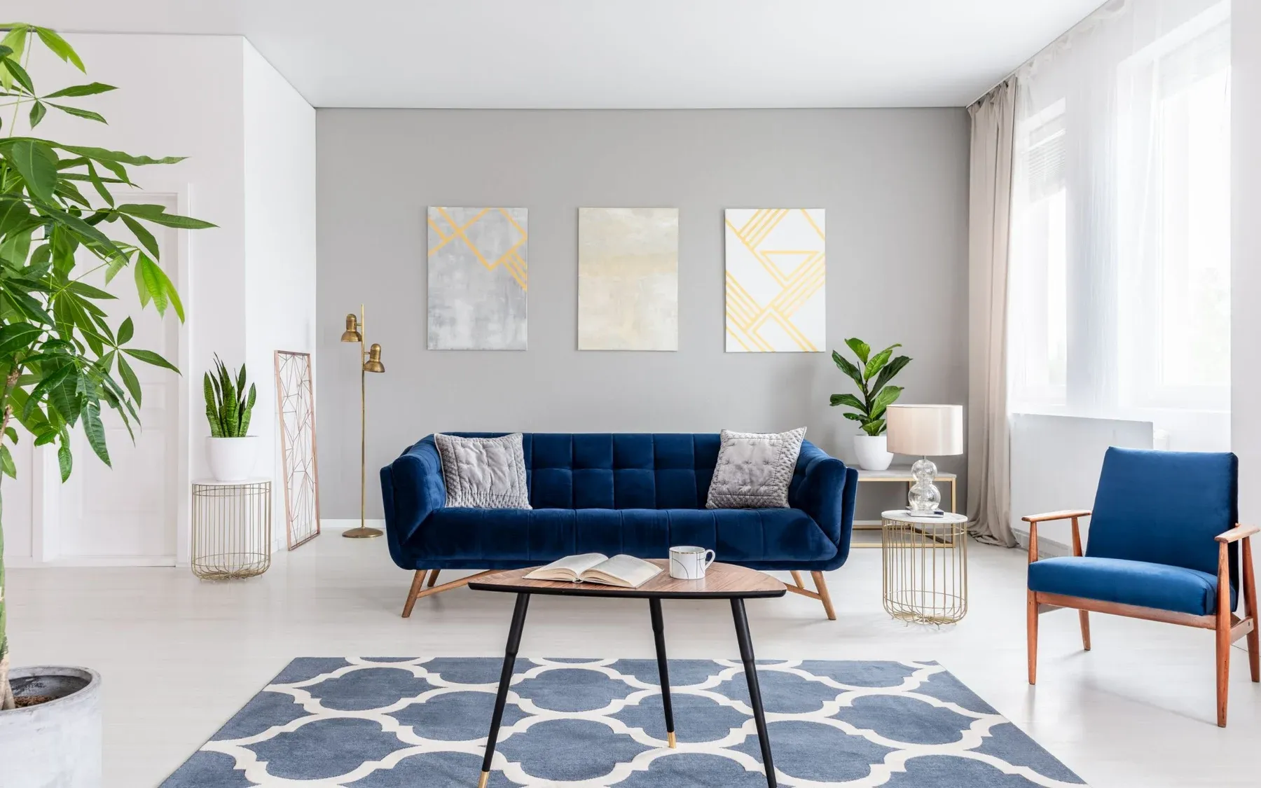 Staged living room with a blue sofa