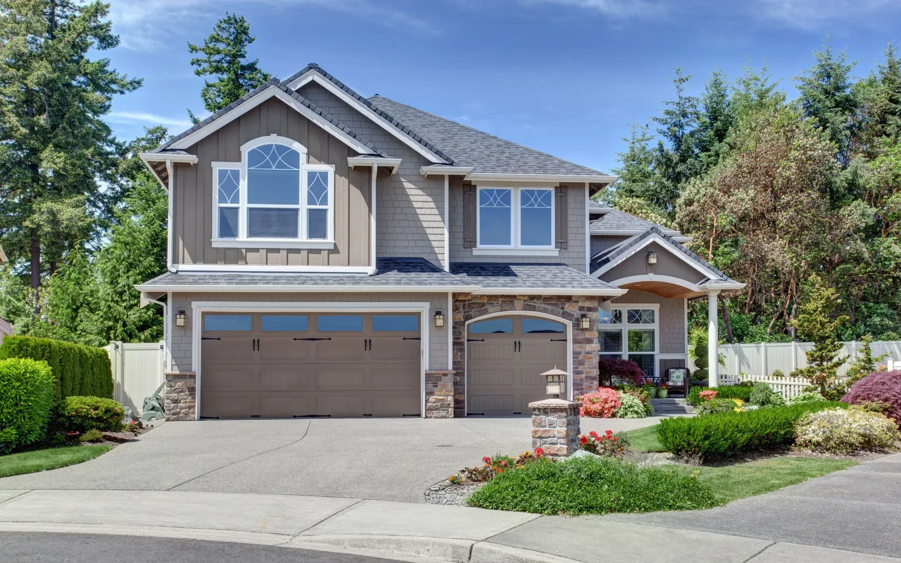 Two-story home with a landscaped front yard