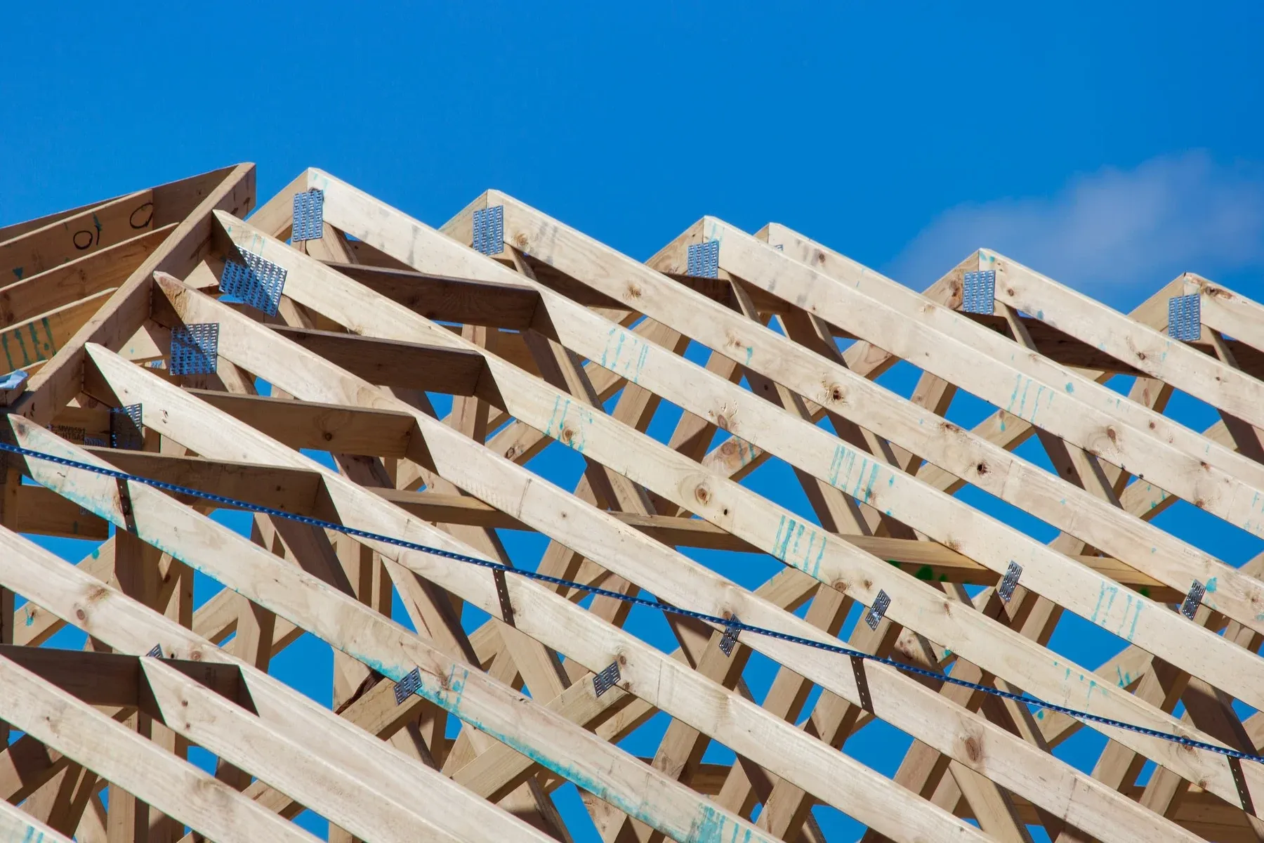 Roof trusses against a blue sky